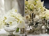 an elegant winter wedding centerpiece of silver bowls and vases with white blooms looks chic and refined