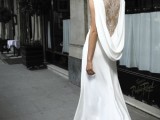 a plain mermaid wedding dress with a cowl back and lace covering it is a unique idea for a bride who wants something different