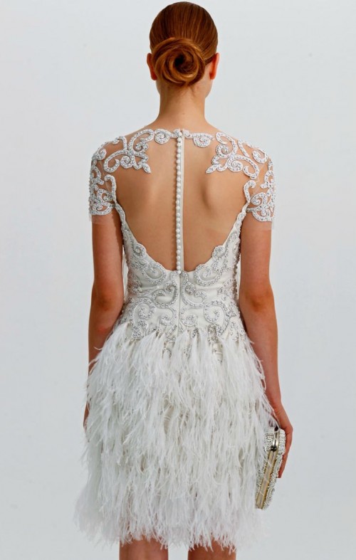 a glam art deco short wedding dress with a feather skirt, a lace embellished bodice and an illusion back on a row of buttons is amazing