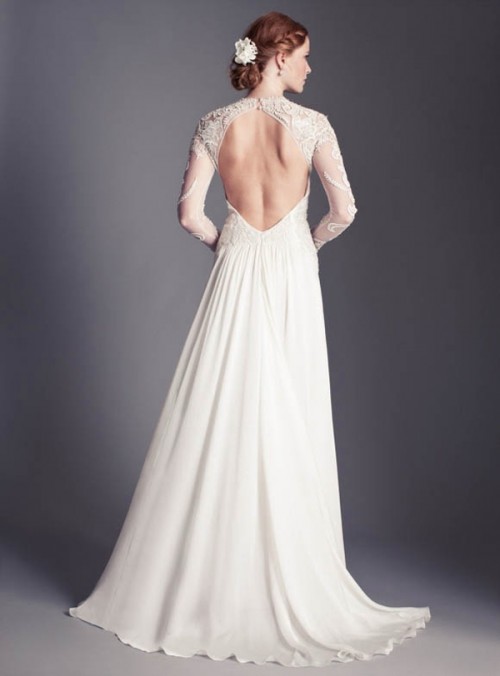 a beautiful A-line wedding dress of a lace bodice and illusion sleeves, a plain pleated skirt with a train and an open back is amazing