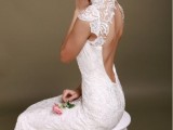 a lace cutout back fitting wedding dress with a high necklne and cap sleeves is a beautiful idea to make a statement