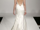 a refined plain mermaid wedding dress with embellished shoulders and a sash and an open back plus a small train is timeless beauty