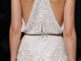 a statement and ultra-modern fully embellished wedding dress with a racerback on a zipper is a lovely and edgy idea to make a statement