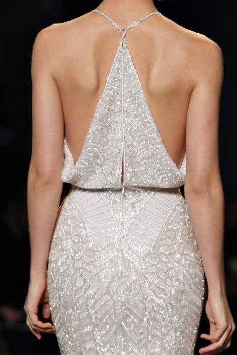a statement and ultra-modern fully embellished wedding dress with a racerback on a zipper is a lovely and edgy idea to make a statement
