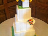 a white Lego wedding cake with Lego figurine toppers is a very fun and whimsical idea for any wedding