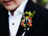 a Lego and berry boutonniere to accent suits in a creative way