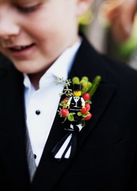 a Lego and berry boutonniere to accent suits in a creative way