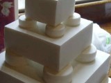 a white Lego wedding cake with colorful Lego toppers looks cool and bold