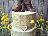 a bark wedding cake with cowboy boots as toppers is a fun and whimsical rustic wedding dessert