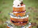 a naked wedding cake with lavender, blooms, pinecones and macarons is a trendy and yummy rustic wedding cake