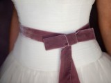 a delicate mauve velvet sash with a bow is a lovely solution for a wedding, it will add a slight touch of color to your look