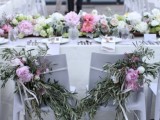 a neutral and pastel floral table garland can substitute any wedding centerpiece