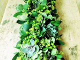 a textural greenery garland with some berries and pale succulents is a cool idea for a cozy natural feel