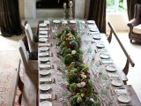a greenery, moss and blooms wedding table garland is a cool and bold idea for any wedding