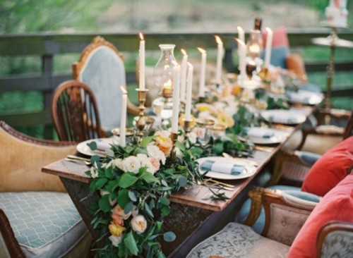 a lush greenery and neutral bloom garland and matching candles for a super chic and romantic feel