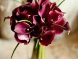 a marsala wedding bouquet of callas and greenery is a bold and cool statement for a fall or winter bride