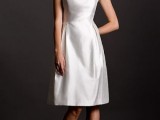 a minimalist sleeveless A-line wedding dress with a high neckline and pleated skirt is a chic and stylish option