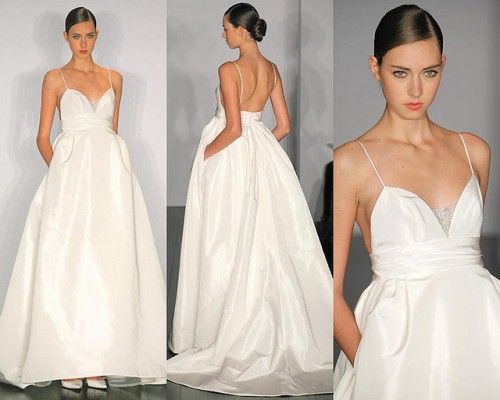 a minimalist wedding ballgown with spaghetti straps, a simple bodice with a shiny insert and pockets is wow