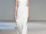 a minimalist sheath wedding dress with draperies and layers here and there for a modern bride