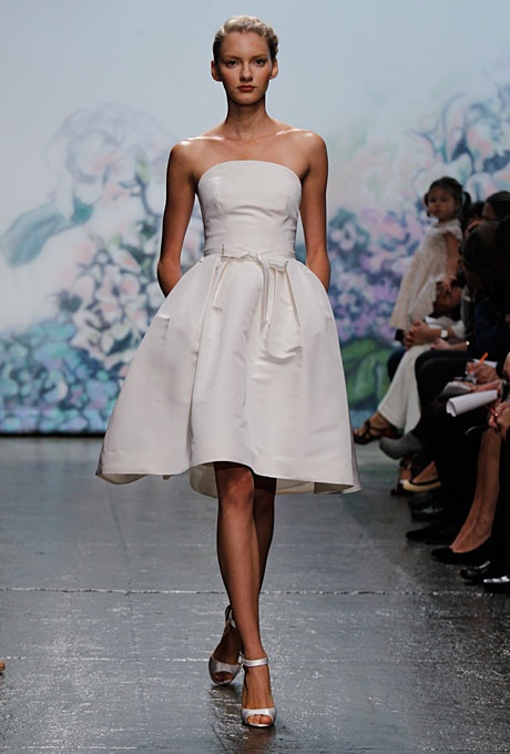 a strapless wedding ballgown with a fully knee skirt and a sash to highlight the waist is a cool option