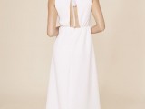 a minimalist A-line wedding dress with a cutout back and some beading hanging in the cutout is a cool idea for a minimal to retro look