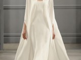 a minimalist strapless A-line wedding dress with a matching capelet on it is a chic and bold combo to rock