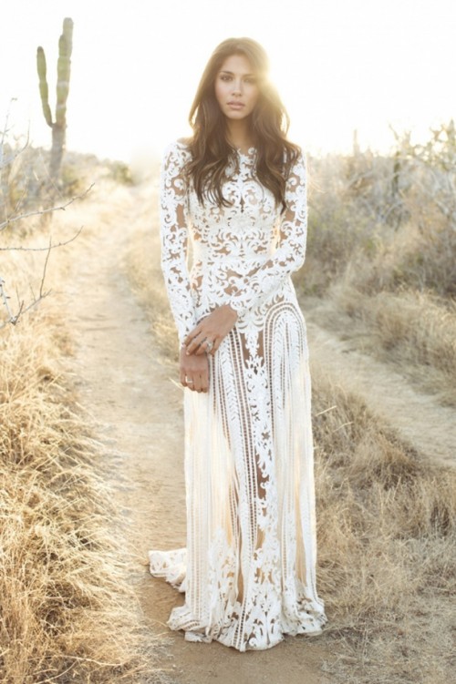a boho nude lace fitting wedding dress with a high neckline and long sleeves plus a train is a bold idea