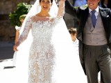 a sheath nude lace wedding dress with a high illusion neckline and long sleeves plus a train and a veil