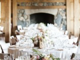 a wooden box with pink and white flowers plus some greenery is a chic and cozy barn wedding centerpiece