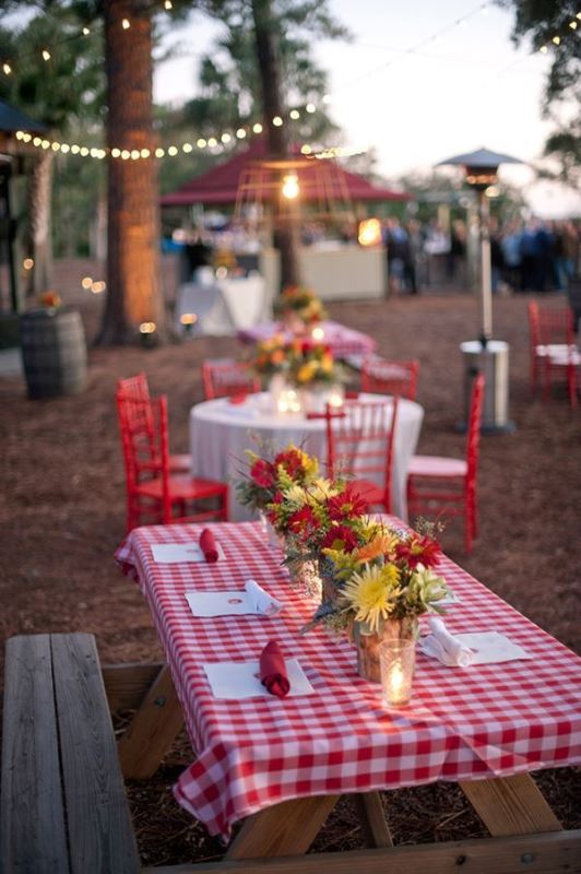A colorful summer picnic with simple furniture, bright blooms and plaid textiles is a cool idea for a rustic rehearsal