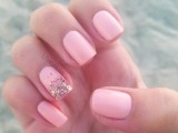 a light pink wedding manicure with an accent nail done with gold glitter is a lovely idea for a glam and cool bridal look