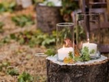 line up your wedding aisle with tree stumps, leaves and candles to get that fall woodland feel at once