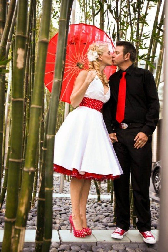 A couple dressed in black, white and red for a chic and bright look