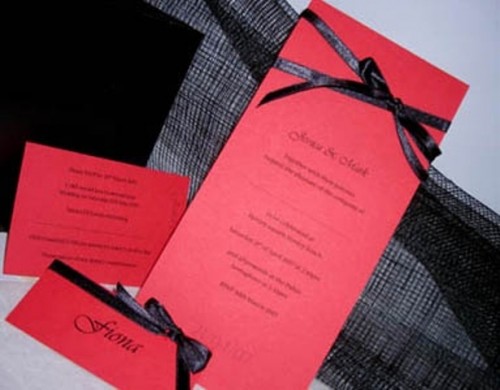 red wedding stationary with black bows is a timeless combo with an elegant feel