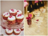 cupcakes with icing and red toppers and striped red and pink liners, drinks with berries