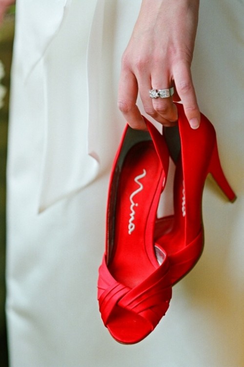 a pair of vintage red peep toe heels is a timeless idea for many brides, and cna be used at such a wedding, too
