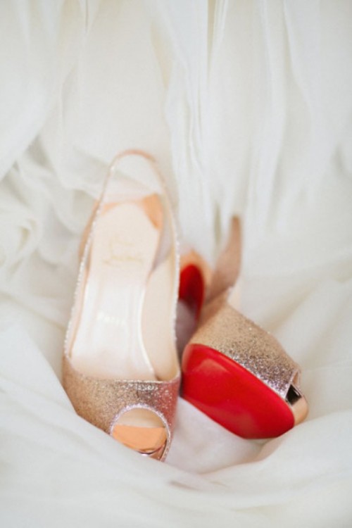 gold wedding shoes with red bottoms are great to match the color scheme