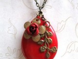 a red pendant with gold detailing is a chic idea for a bride or bridesmaids will be a cool vintage accessory