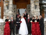 red vintage maxi bridesmaid dresses with dark faux fur shawls, red ties and waistcoats on the groomsmen are amazing for a winter wedding