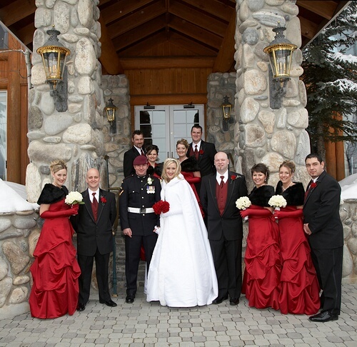red vintage maxi bridesmaid dresses with dark faux fur shawls, red ties and waistcoats on the groomsmen are amazing for a winter wedding