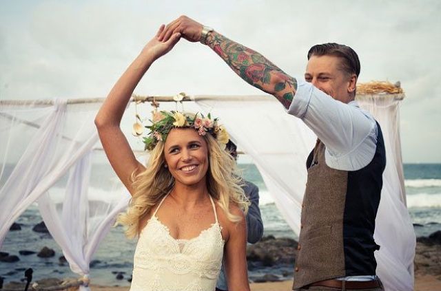 a boho lace wedding dress with spaghetti straps and a floral crown are a great idea for a boho chic wedding