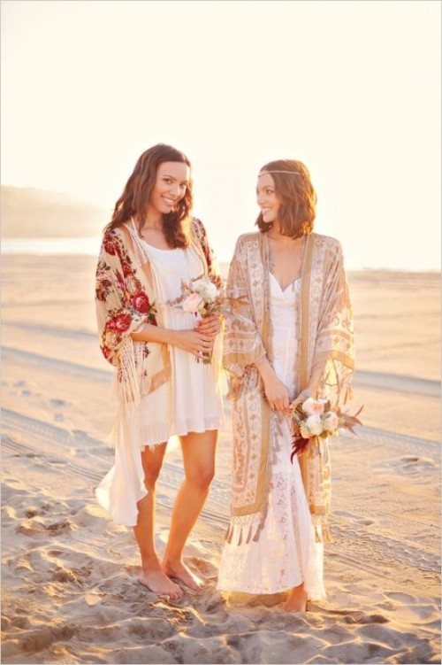boho beach brides wearing simple white wedding dresses and colorful and neutral tassel kimonos plus a chain