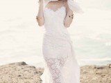a boho lace wedding dress with spaghetti straps and an illusion skirt, a chain hairpiece are great for a beach boho bride