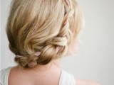 a rustic braided halo wedding updo with a neutral ribbon interwoven is a lovely idea for a rustic or boho bridal look