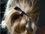 a super messy twisted and loose low bun with a black ribbon is a lovely idea for a laid-back and relaxed look