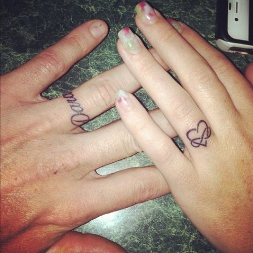 a lovely wrapped heart-shaped tattoo on the ring finger is a bold and cool idea to substitute a usual wedding ring