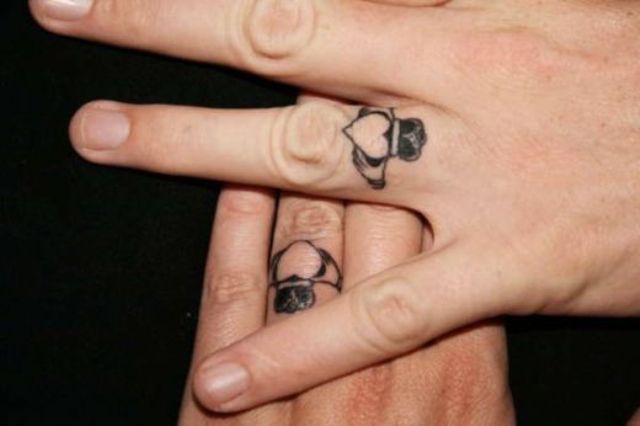 Hearts with crowns tattoos on the ring fingers are amazing for rocking them instead of usual wedding rings