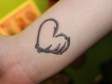 a creative antler heart tattoo on the wrist is a pretty and chic idea for rocking instead of your wedding ring or together with it