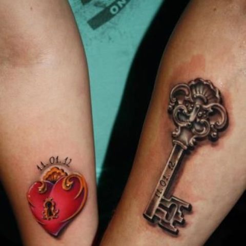 large colorful heart lock and vintage key tattoos with the wedding date on the arms are amazing to memorize your wedding date