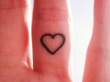 a little heart-shaped tattoo on the inner side of your ring finger is a delicate and chic alternative to a usual wedding ring